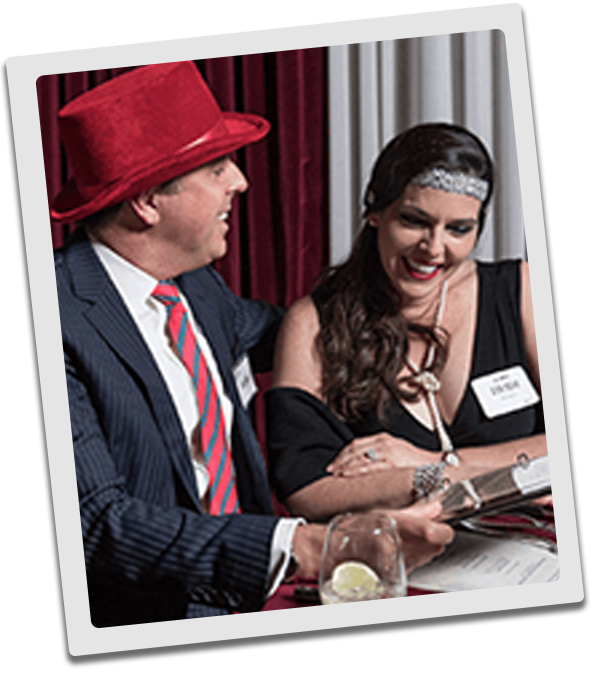 Detroit Murder Mystery couple checking out the dinner menu